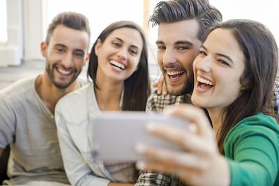 Group of friends taking a selfie near dentist office in Mitchell SD