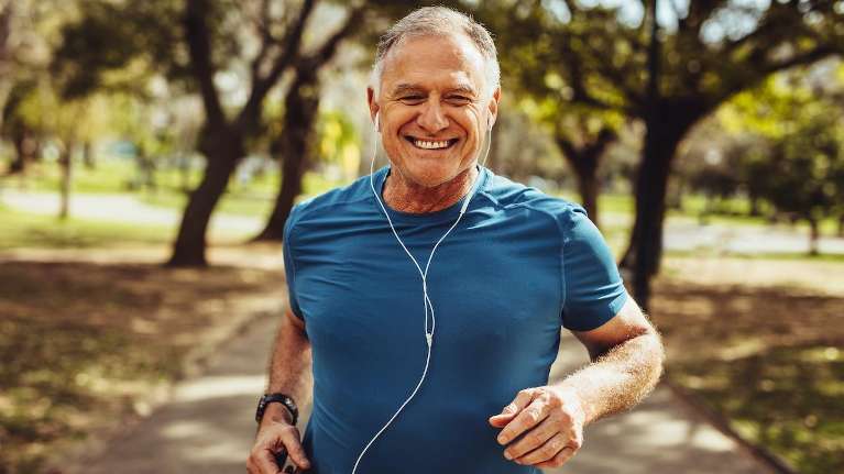 a man smiling while listening to music