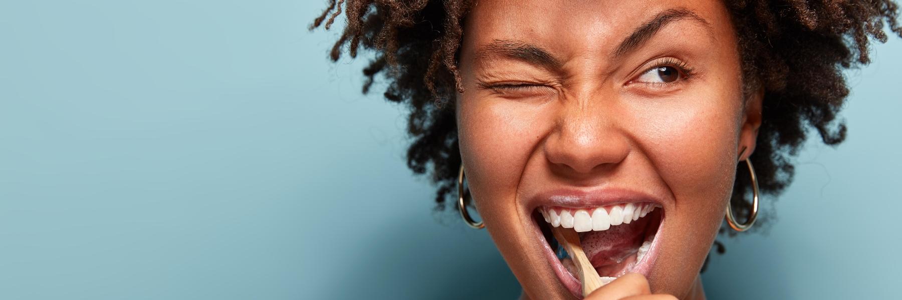 Patient brushing their teeth at dentist in Mitchell, SD