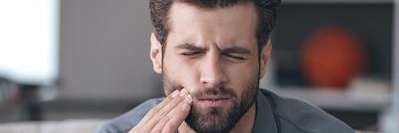 A man with tooth pain in need of a root canal
